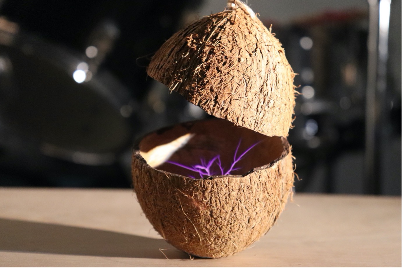 MA Fine Art sculpture by Johann Don-Daniel showing a split coconut with a purple electrical flash inside it.